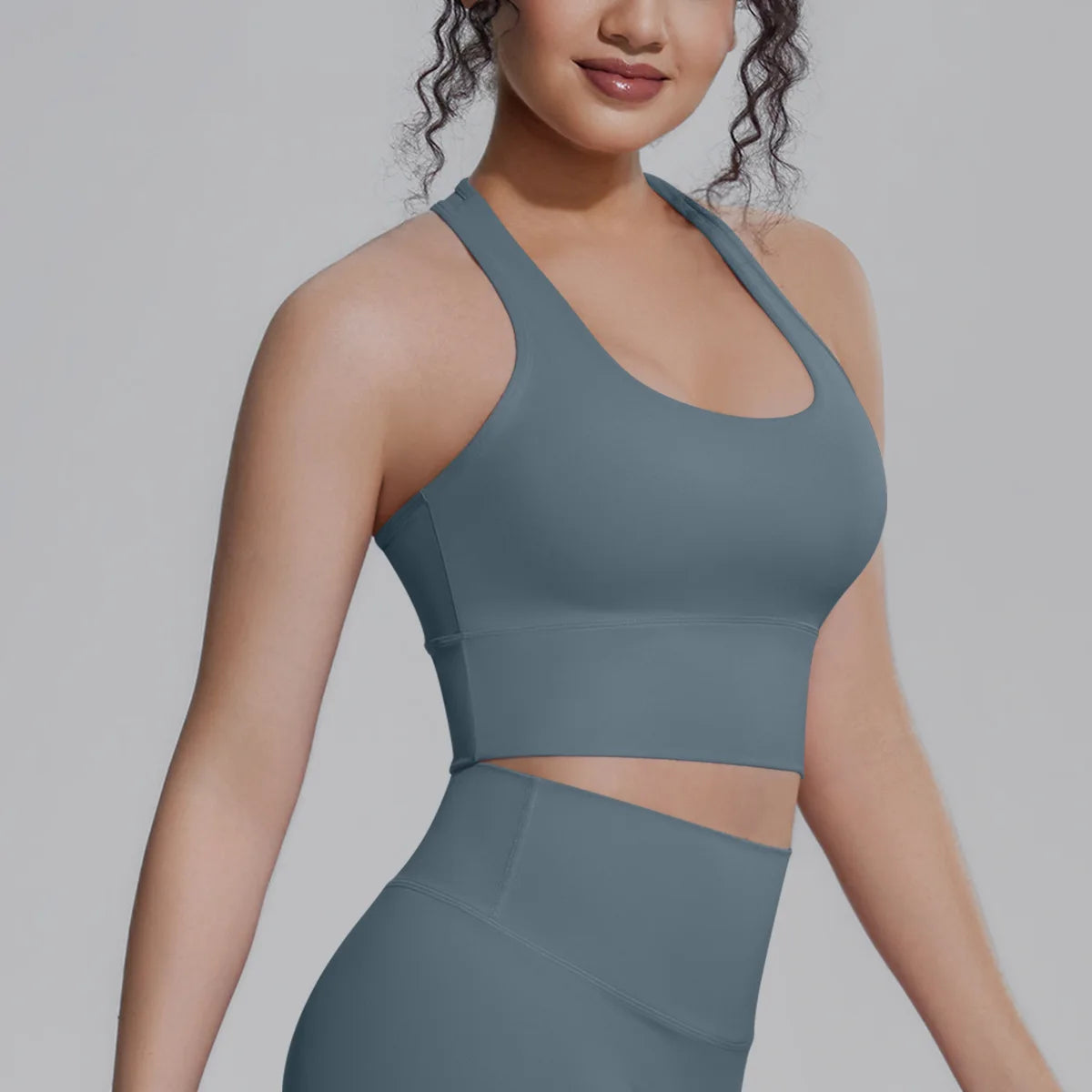 White women's sports top from Corporación Turística, ideal for fitness, running, and training activities.