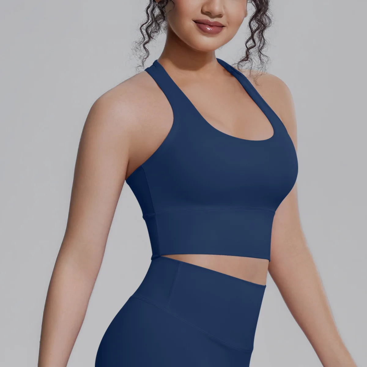 White women's sports top by Corporación Turística, designed for fitness and running, with a comfortable fit and breathable fabric.