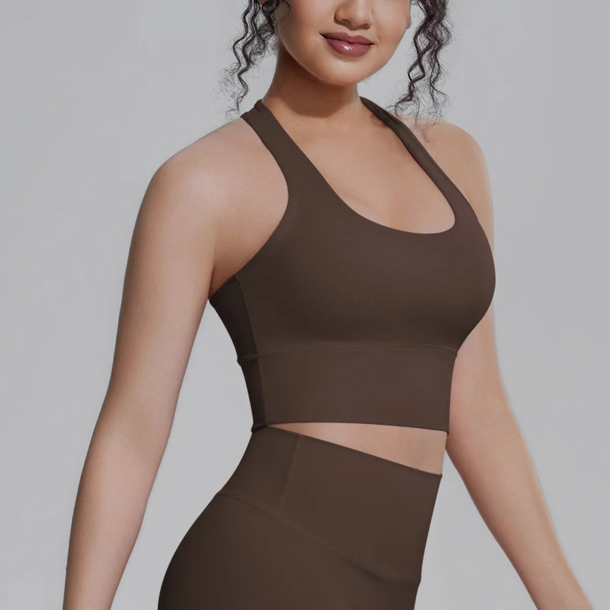 White women's sports top from Corporación Turística, designed for fitness, running, and training activities.
