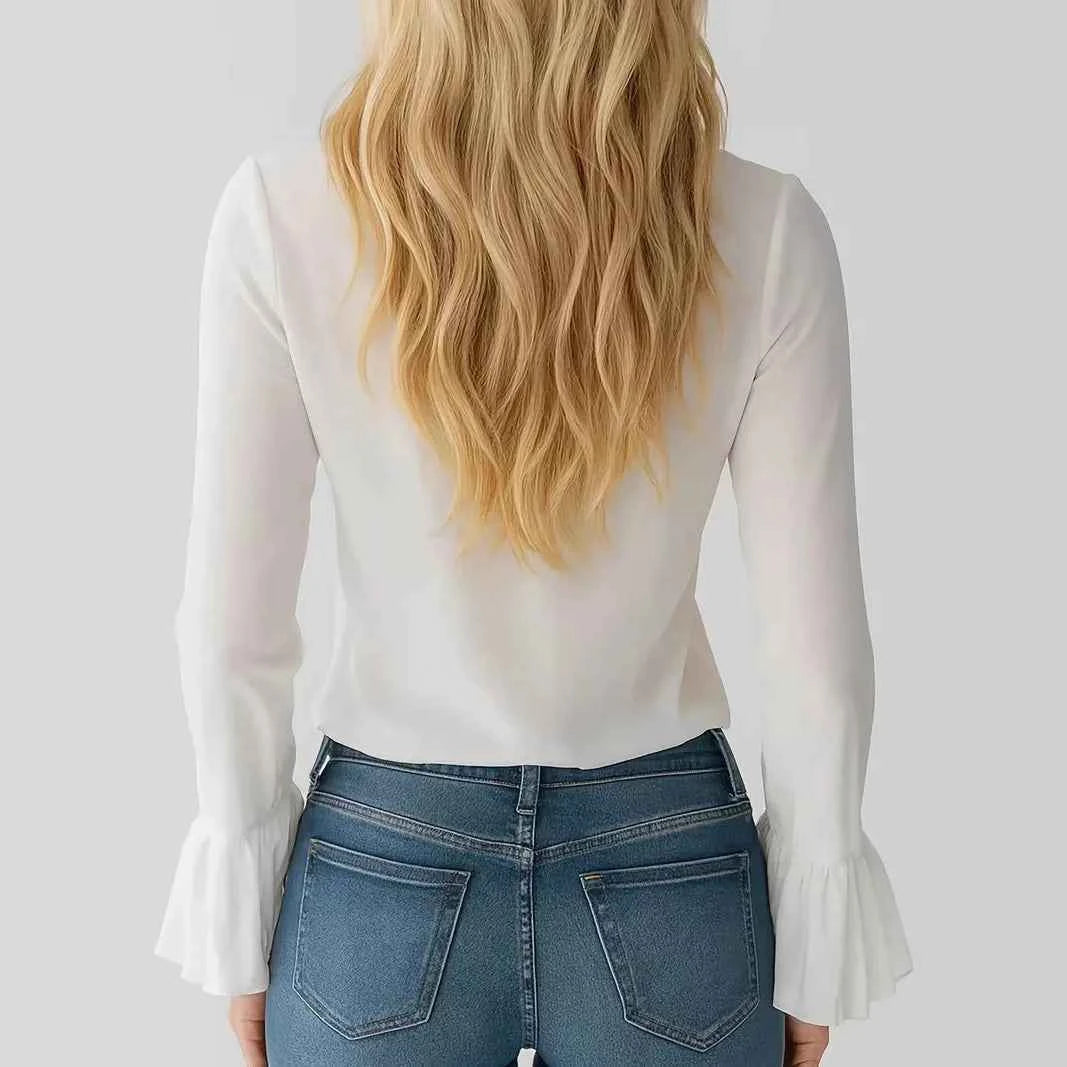 White women's blouse with ruffled details, long flared sleeves, and tie cords, from Corporación Turística.