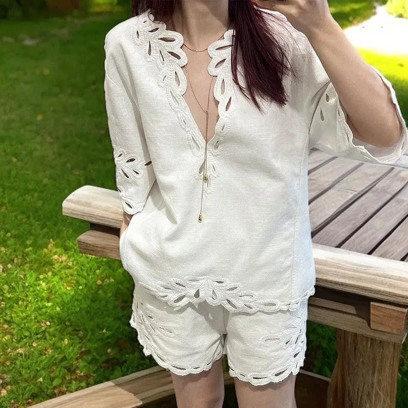 White summer women's crochet dress from Corporación Turística, featuring a stylish, airy, and fashionable design for warm weather.