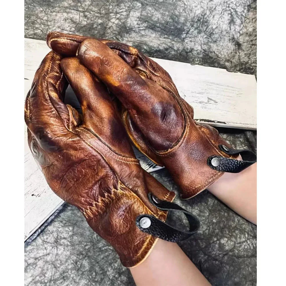 Summer and winter motorcycle gloves in amber color by Corporación Turística, showing the gloves with textured palms and snug fit.