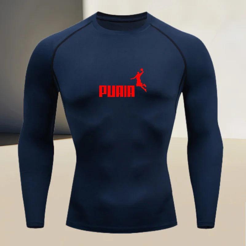 Close-up of Corporación Turística fitted long-sleeve sports T-shirt with round neck, showing fabric texture and dark color.