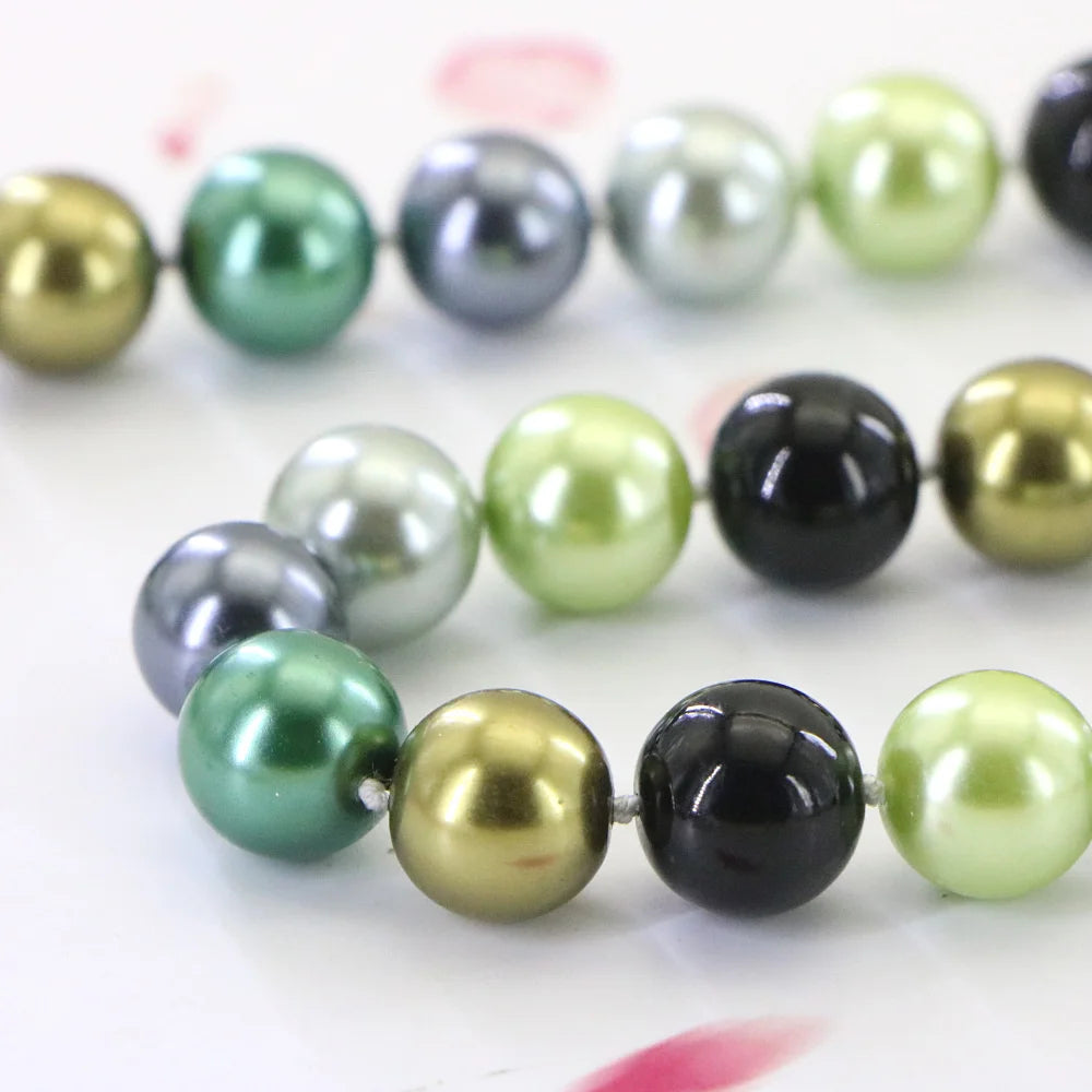 Set of necklace and bracelet with round cone-shaped beads from Corporación Turística, featuring colorful, polished stone accents.