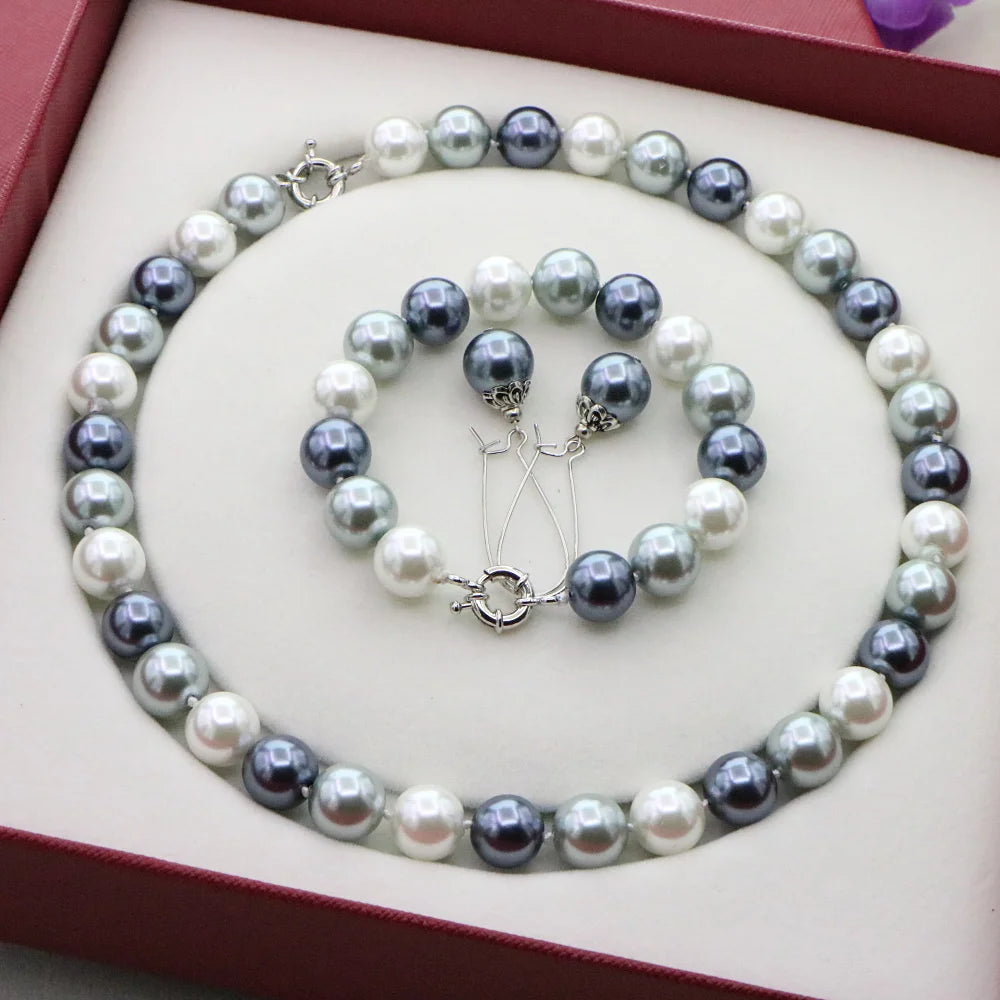 Conjunto de collar y pulsera de cuentas redondas en tonos naturales, de la marca Corporación Turística, para accesorios elegantes y casuales.