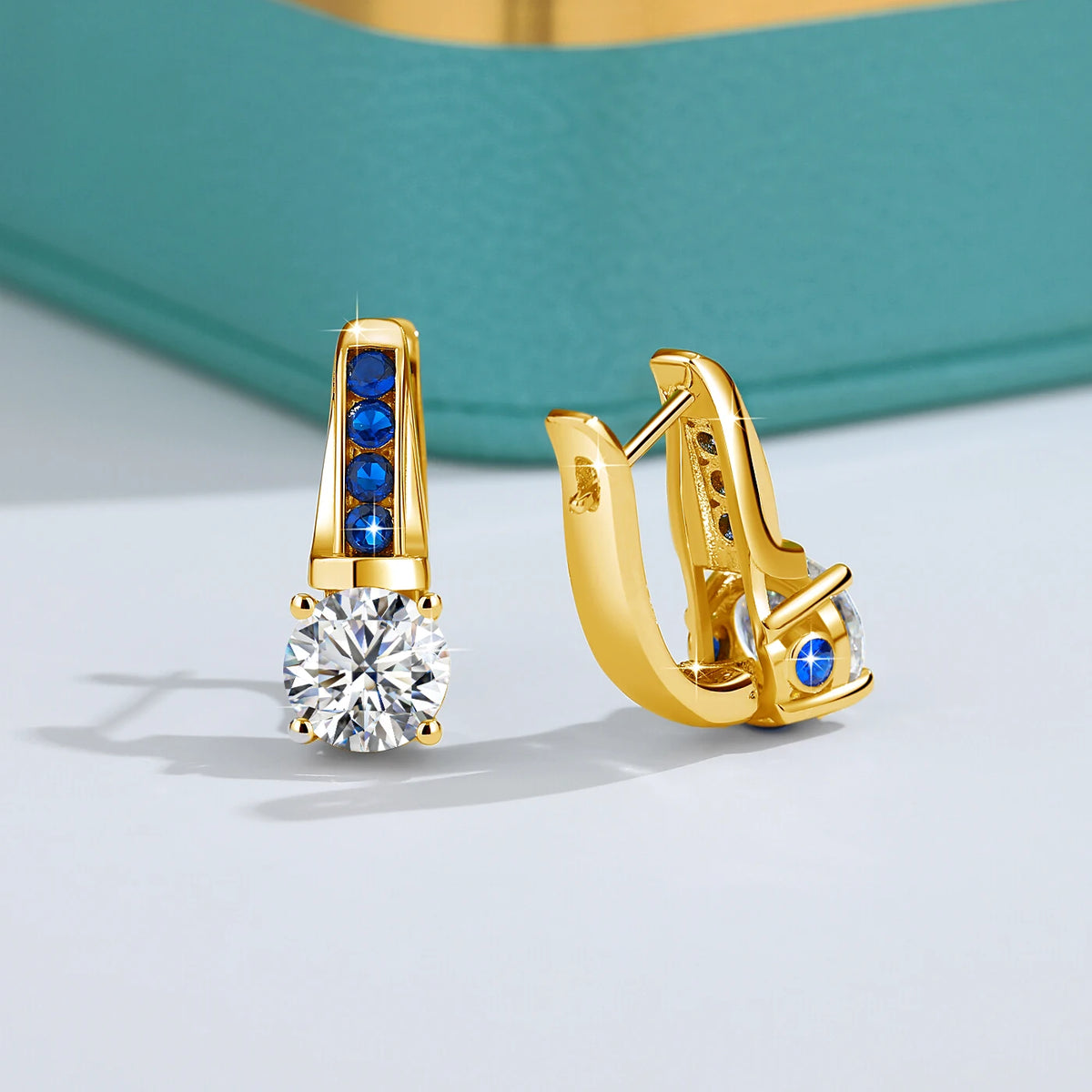 Gold moissanite diamond earrings with certification, featuring sparkling D color moissanite gemstones set in yellow gold.