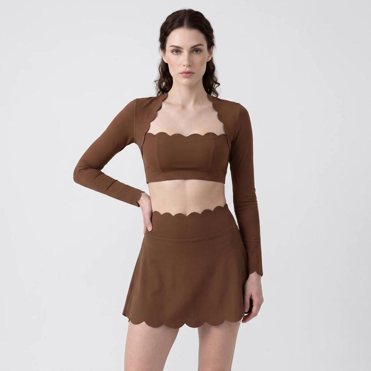 Yellow women's sports set from Corporación Turística's Serie Scallop Petal, includes sports top and bottoms for active wear.