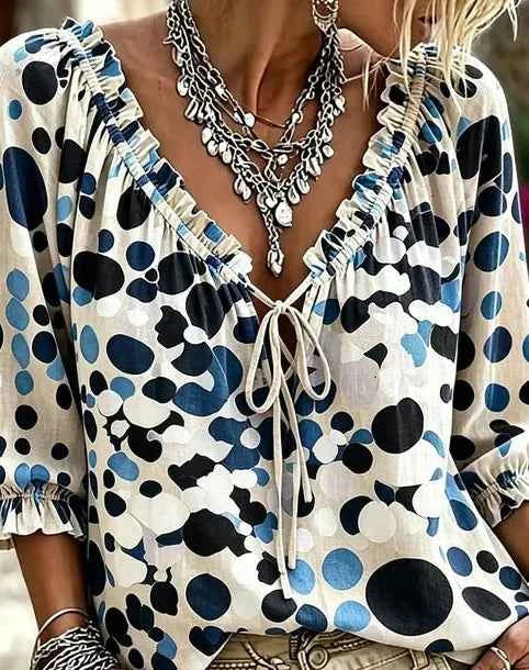 Bohemia summer blouse for women with loose fit, floral print, and V-neck design by Corporación Turística.
