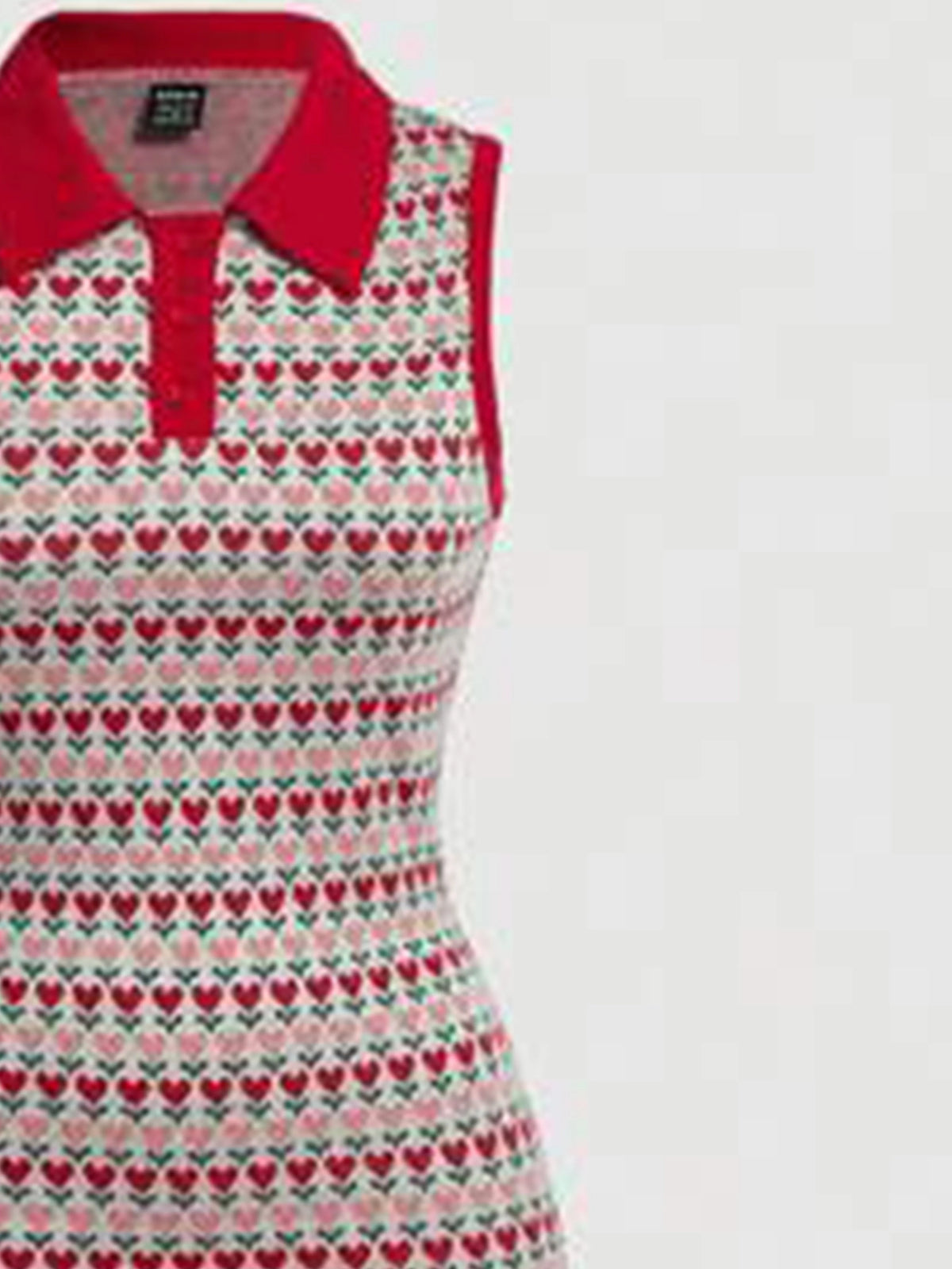 Elegant sleeveless knitted dress with lapel collar from Corporación Turística, shown with detailed fabric and stylish design.