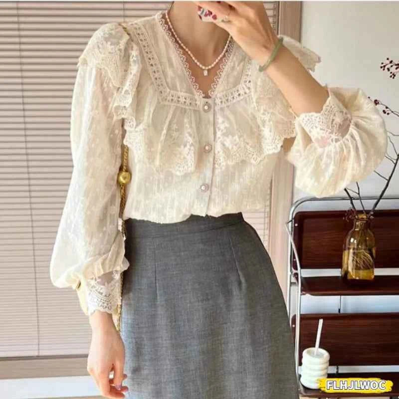 White elegant blouse with ruffles and long sleeves by FLHJLWOC, suitable for office wear, featuring a stylish and sophisticated design.