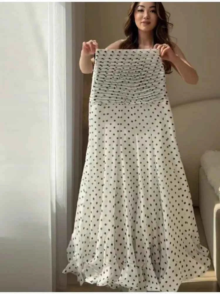 Elegant HOLD YOUNG maxi mermaid skirt with polka dots and ruffles, perfect for a sophisticated summer look.
