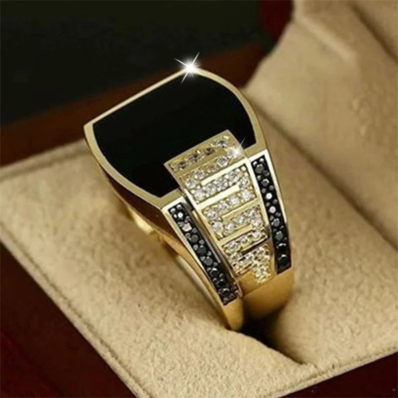 Gold men's punk ring with black stone and cubic zirconia, suitable for wedding or engagement jewelry.