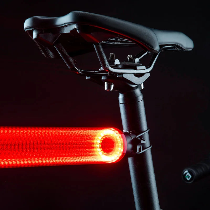 ROCKBROS smart rechargeable bicycle rear light with safety features, designed for nighttime visibility and bike safety.