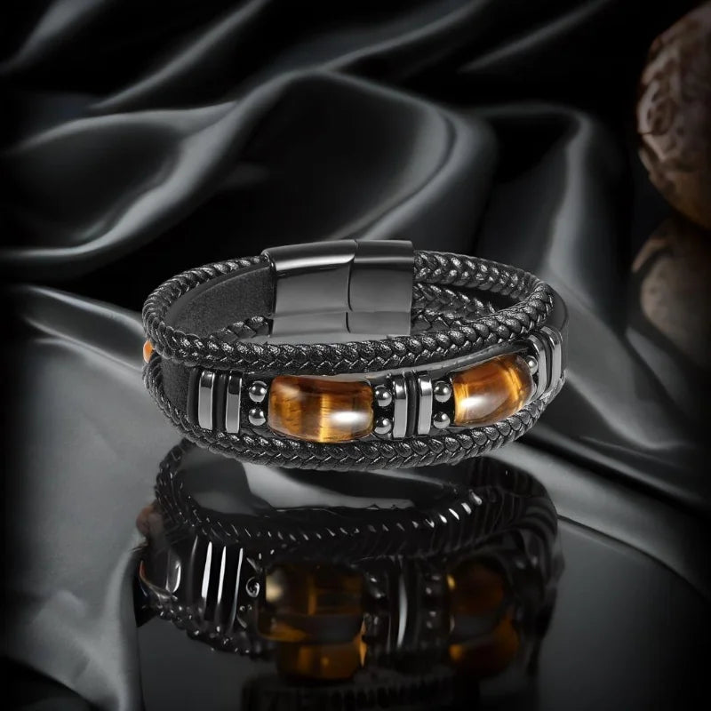 Black leather men's bracelet with tiger's eye bead by RUIYI, featuring protective and stylish design.