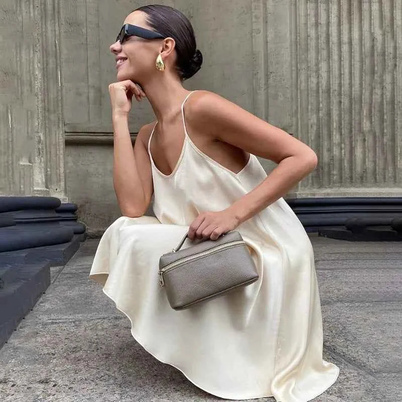 Ticketsx elegant summer satin dress in apricot color, lightweight and stylish for warm weather occasions.