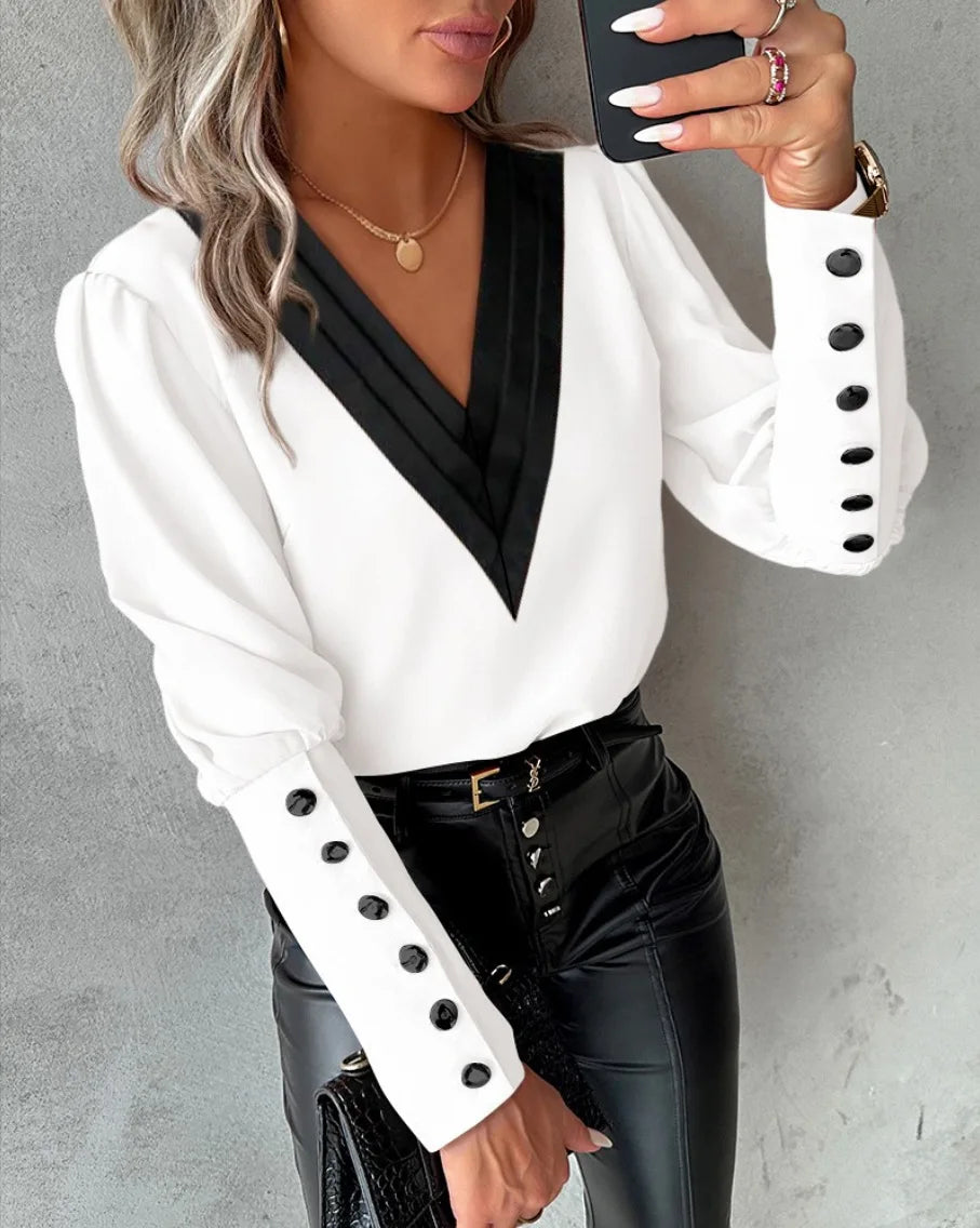 Office blouse for women with V-neck collar and buttons, in a professional style, by Corporación Turística.