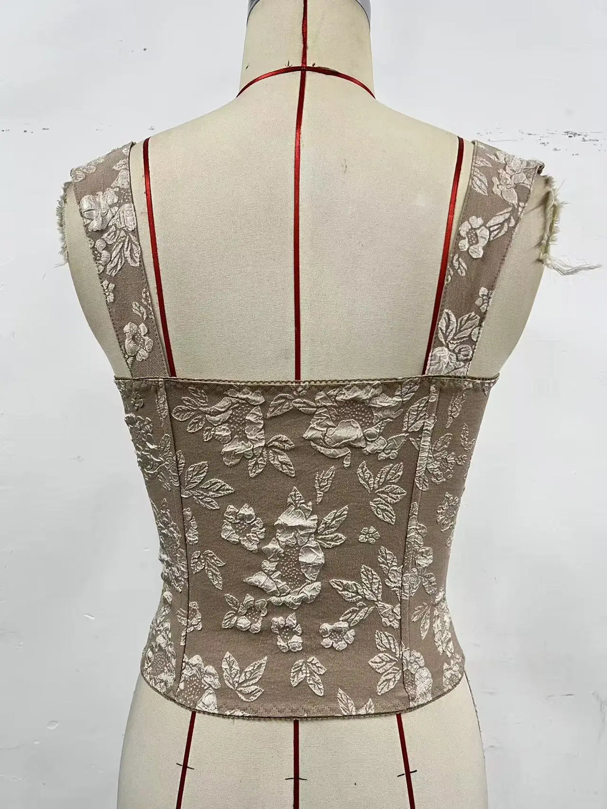 Retro floral jacquard corset top for women with adjustable straps, featuring a vintage-inspired design and intricate floral patterns.