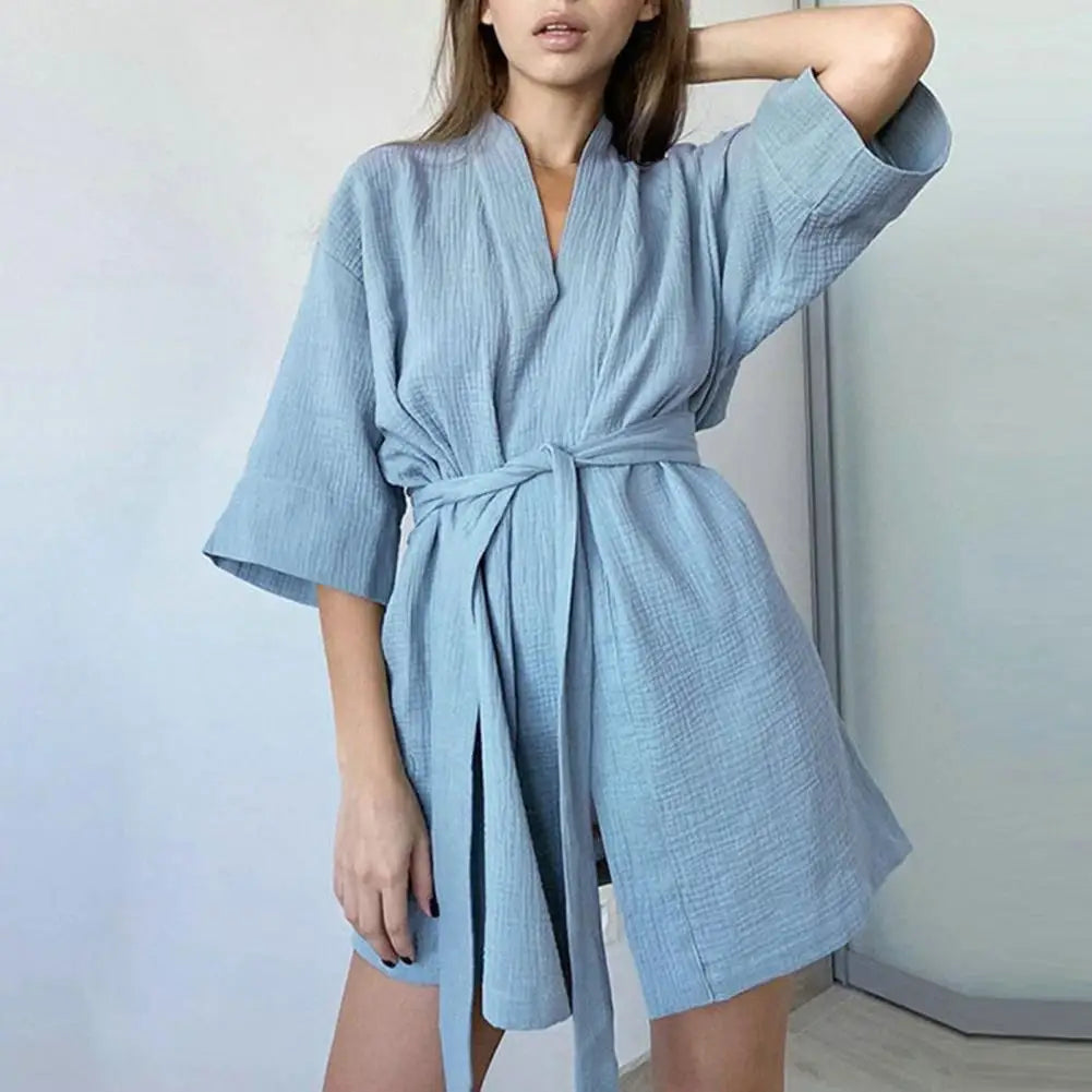 Soft cotton women's bathrobe with a mini length and corded design, perfect for comfortable lounging.