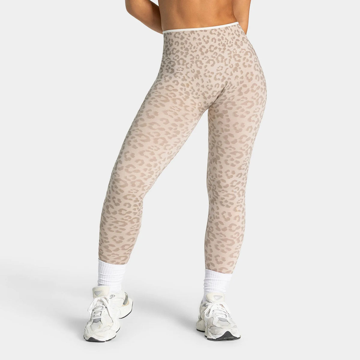 Leopard print women's yoga set by Corporación Turística, includes matching top and leggings for activewear and comfort.