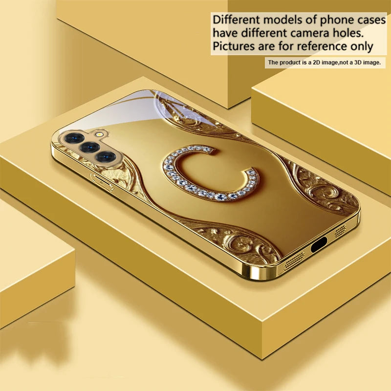 Gold crystal phone case with diamond accents for smartphone protection, featuring an elegant and luxurious design.