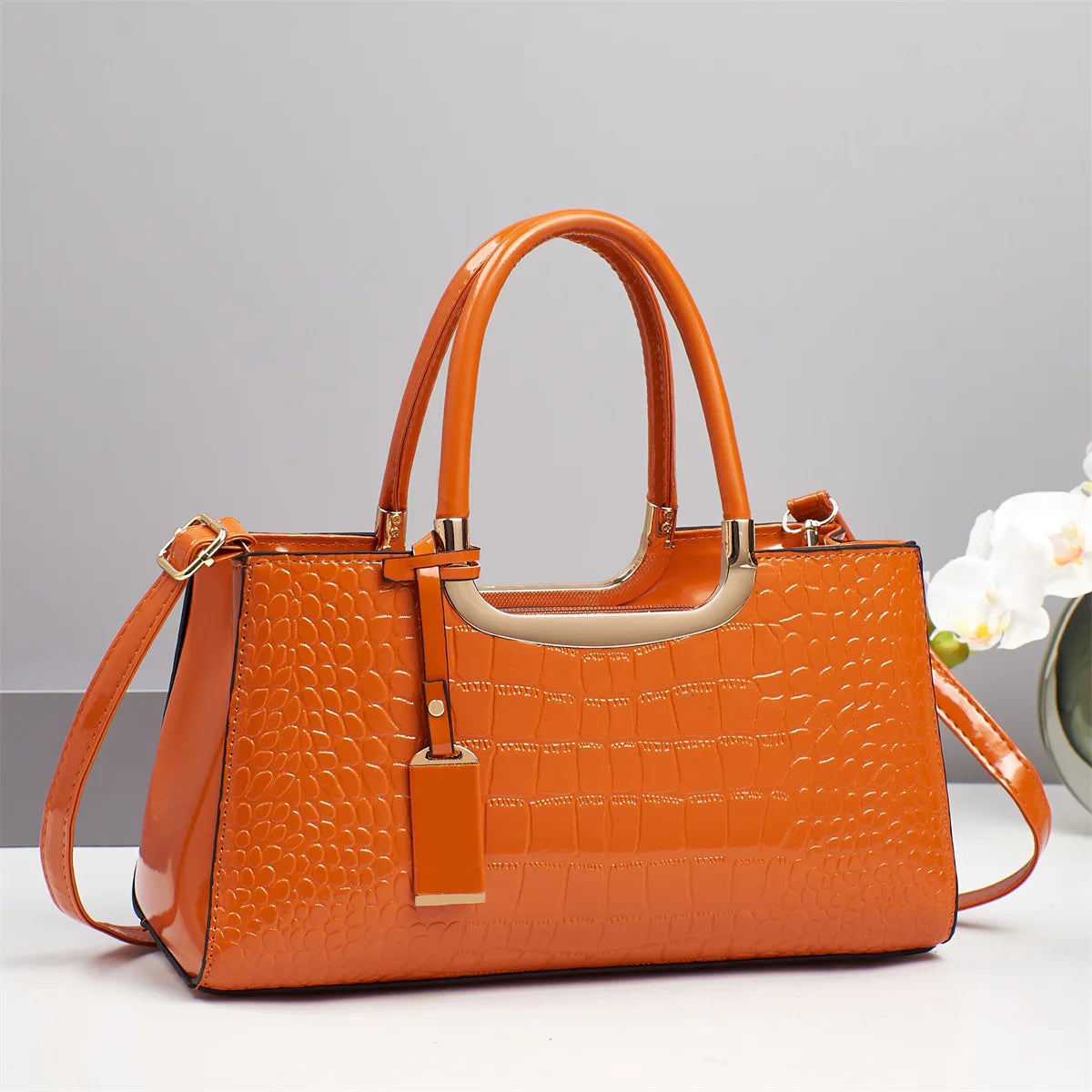 Western-style women's shoulder bag by Corporación Turística, featuring a stylish design with leather accents and decorative stitching.