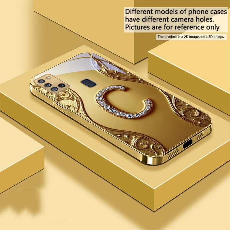 Gold crystal phone case with diamond accents, designed for a smartphone, featuring a luxurious and sparkling protective cover.