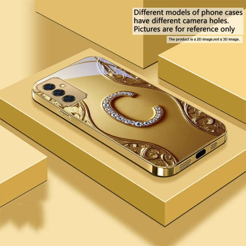 Golden crystal phone case with diamond accents, designed for a stylish and luxurious look on smartphones.
