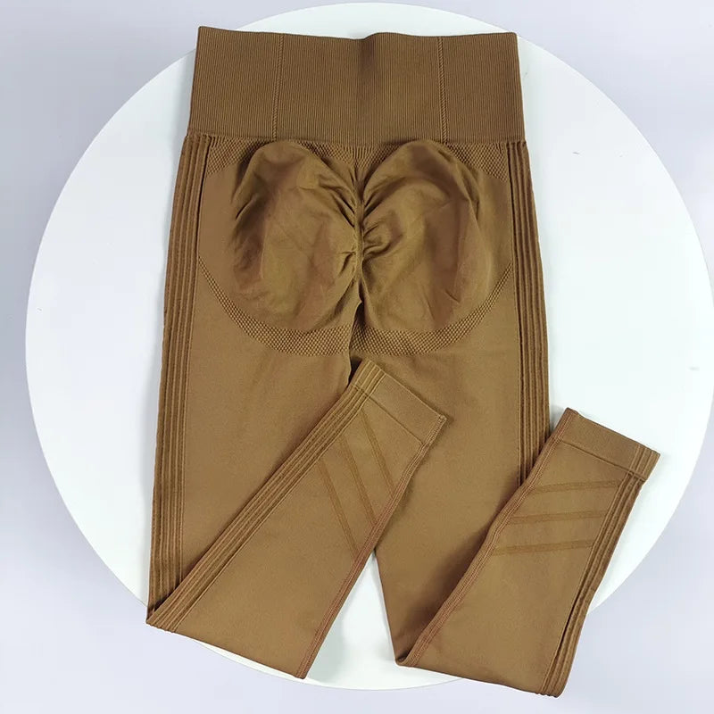 High-waisted women's yoga leggings in stretchy fabric, featuring a sleek design and comfortable fit for active wear.