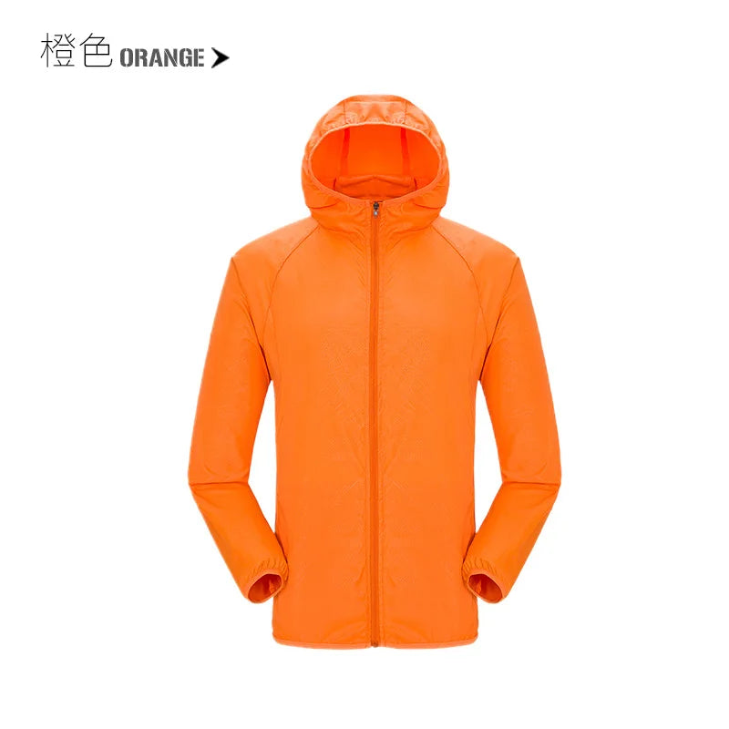 Lightweight waterproof camping rain jacket for men and women by Corporación Turística, shown in an outdoor setting.