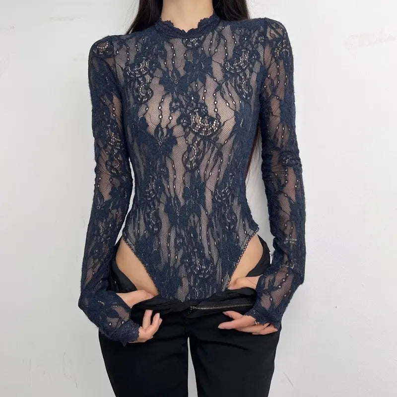 Woman wearing a Corporación Turística Nuevo body with a high neckline and long sleeves, shown in a stylish black design.