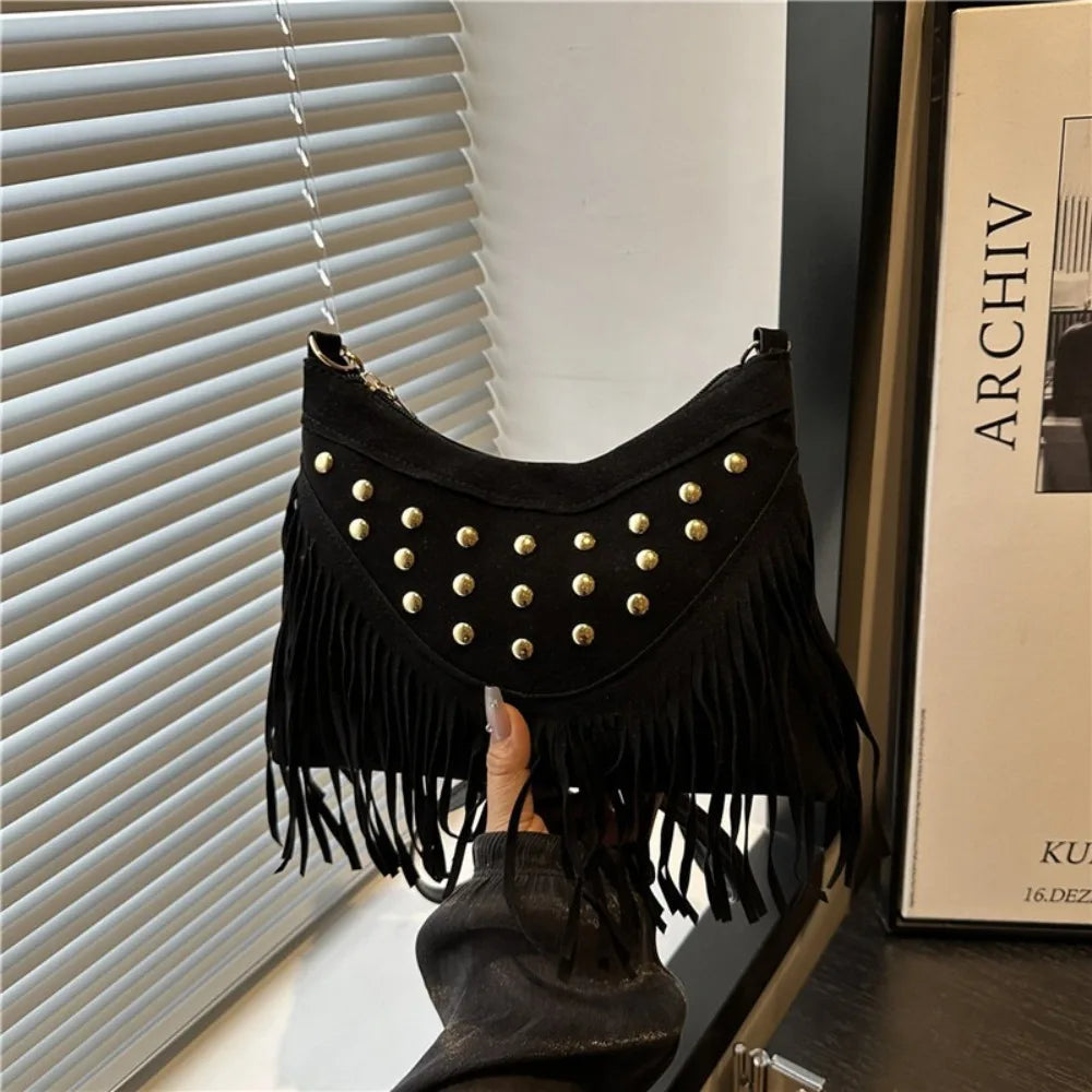 Vintage Korean-style shoulder bag with rivets, bohemian design, featuring multiple compartments and a stylish, durable exterior.