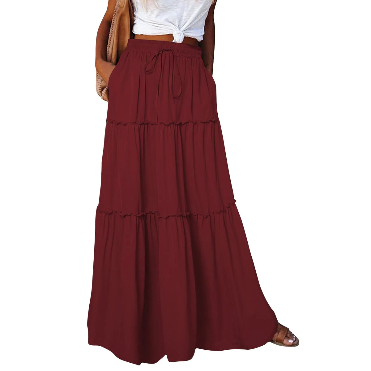 Long women's skirt with solid color and elastic waistband, featuring a flowing fabric for comfortable, stylish wear.
