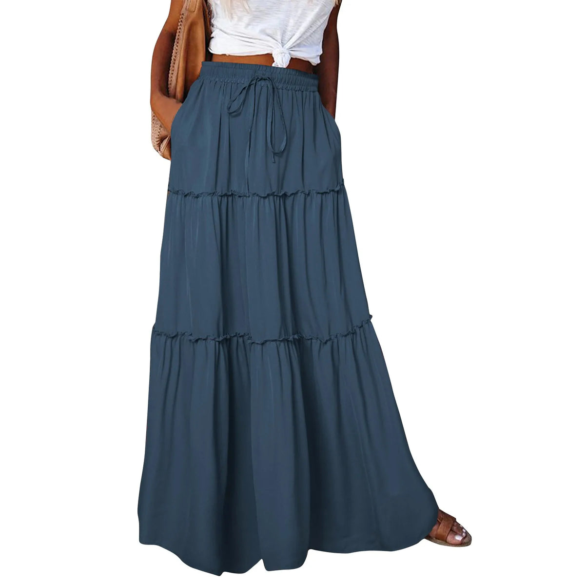 Long solid-colored women's skirt with elastic waistband, styled for casual or dressy occasions.