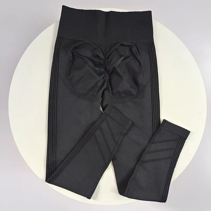 High-waisted women's yoga leggings made of stretchy fabric, featuring a sleek, seamless design for comfort and flexibility.