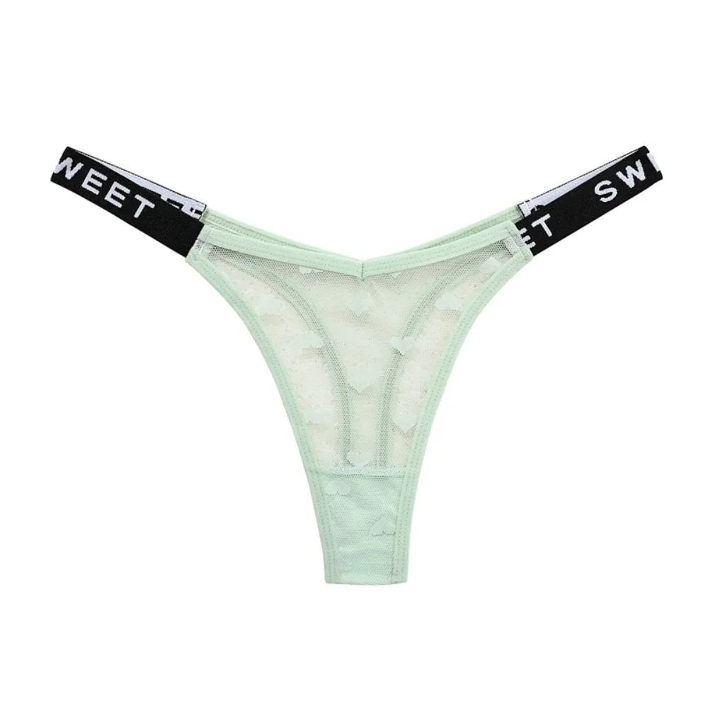 Cotton thong underwear with heart mesh design, seamless fit, by Corporación Turística, shown on a model.