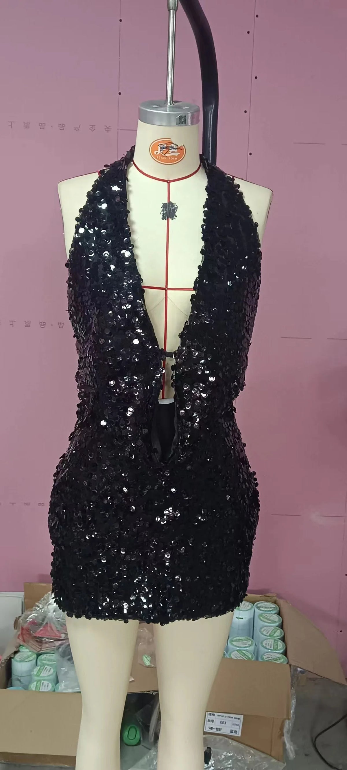 Two-piece sexy sequin set featuring sleeveless top, perfect for evening wear, by Corporación Turística.