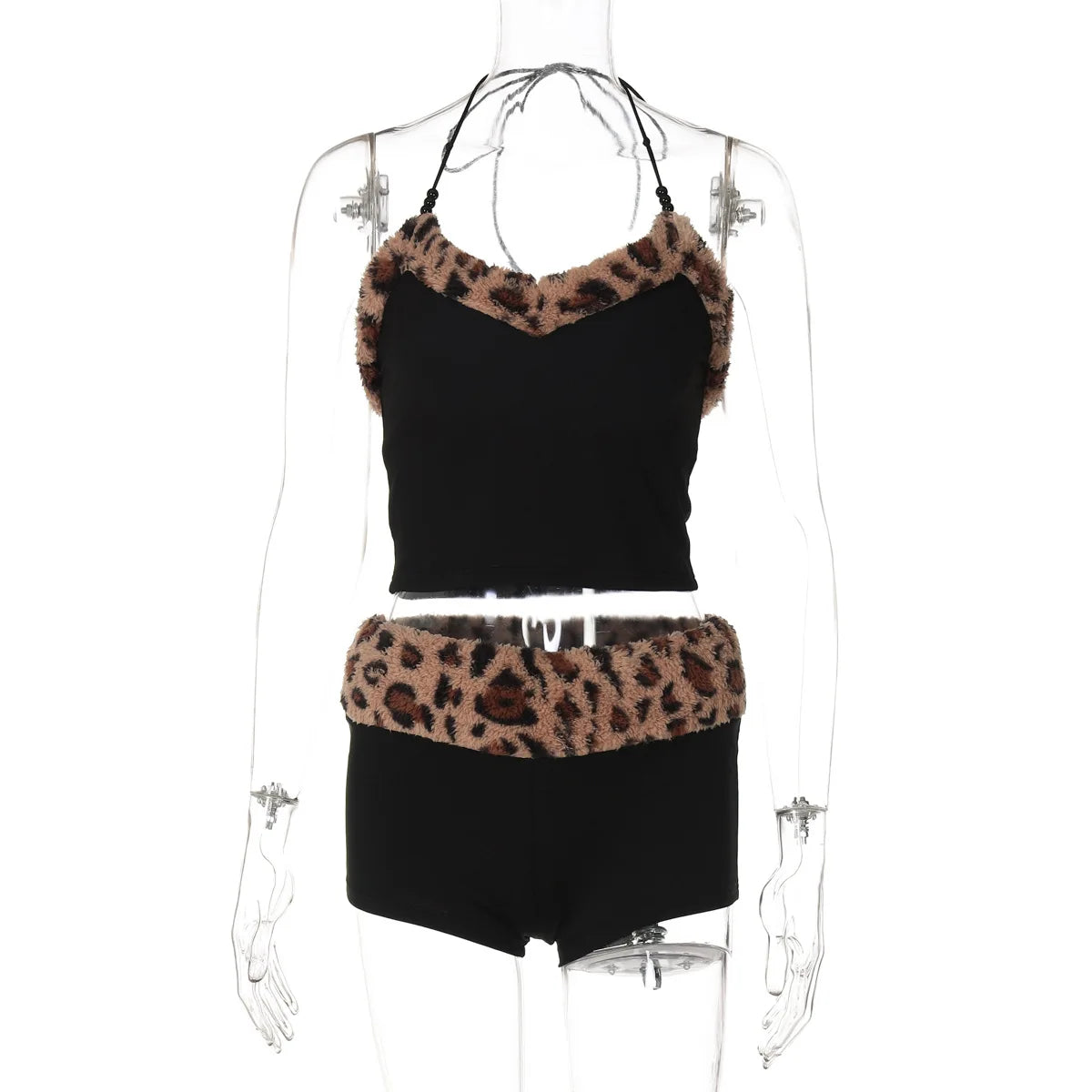 Pair of matching 2-piece set with sling from Corporación Turística, featuring coordinated fashion design and vibrant fabric.