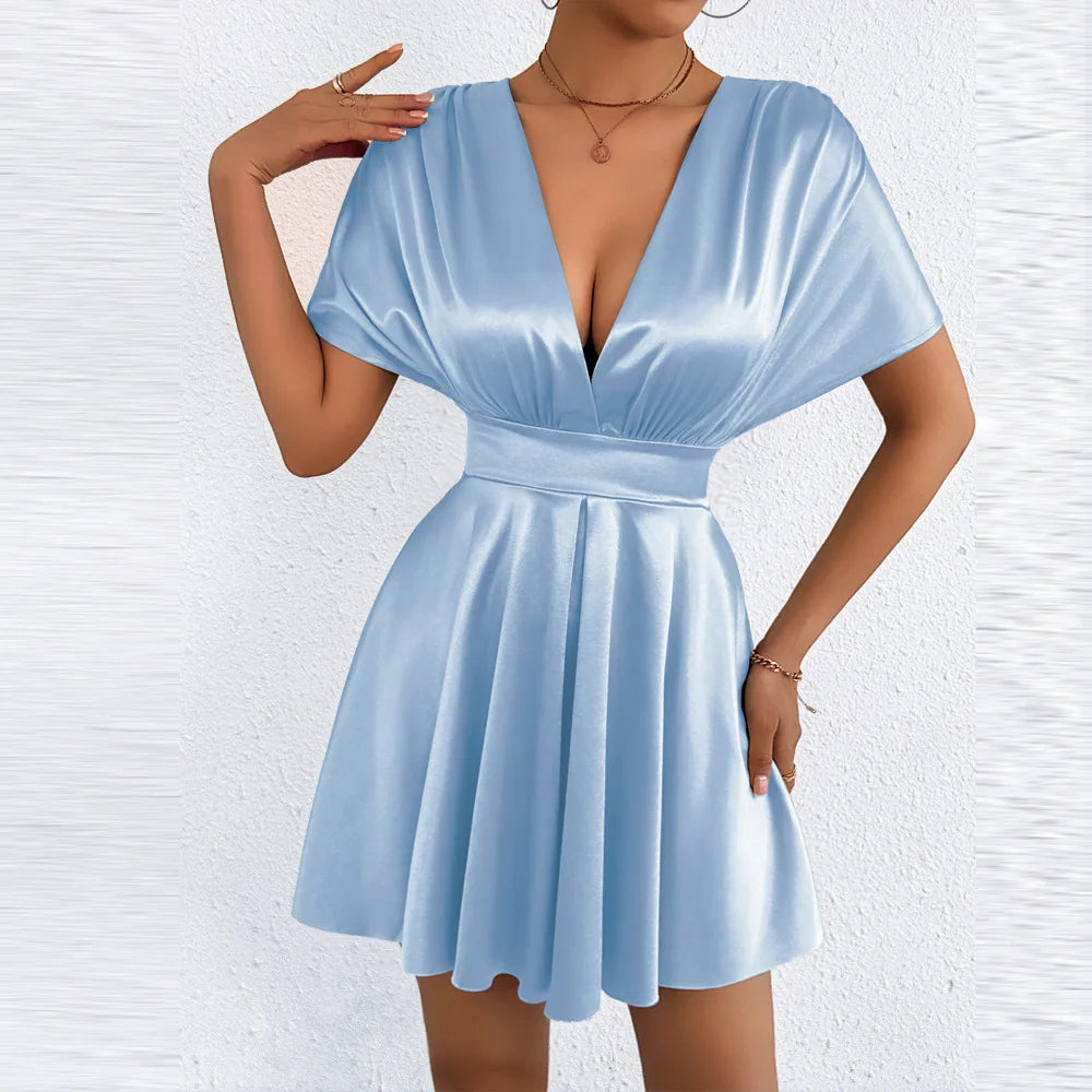 Elegant sexy dress with V-neckline and low waist by Corporación Turística, featuring a fitted silhouette and stylish design.