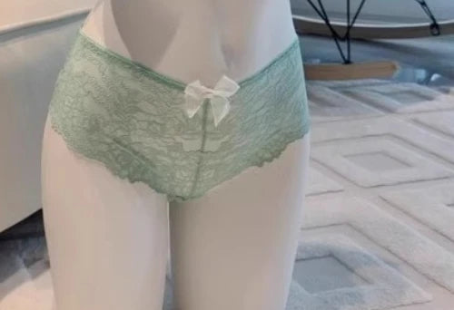 Green mint YUQI halter neck bra set with supportive cups and adjustable straps, ideal for stylish, comfortable wear.