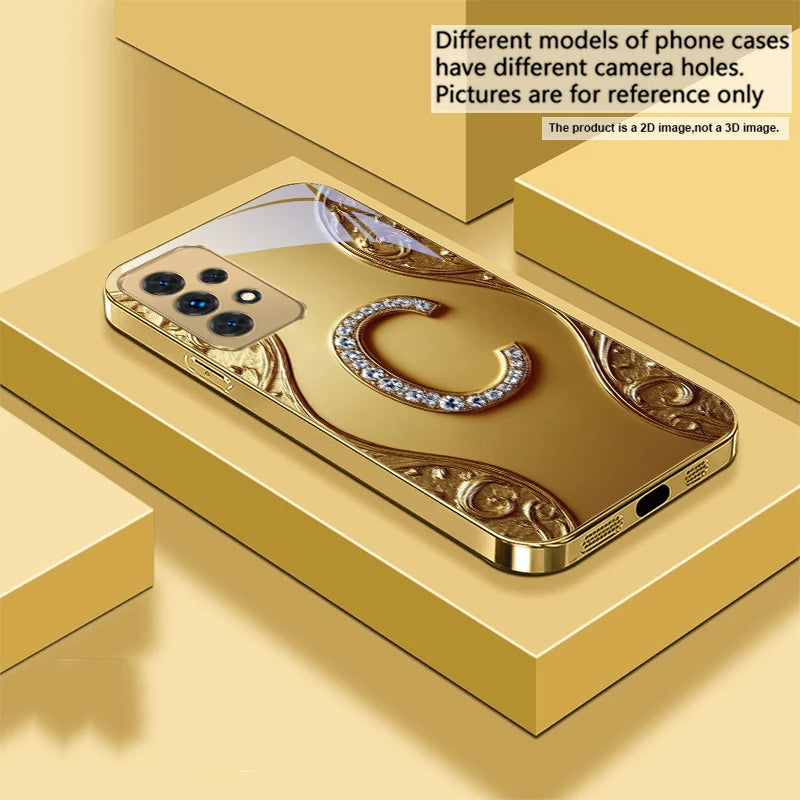 Gold crystal phone case with diamond accents, designed for a stylish and luxurious look, featuring intricate detailing.