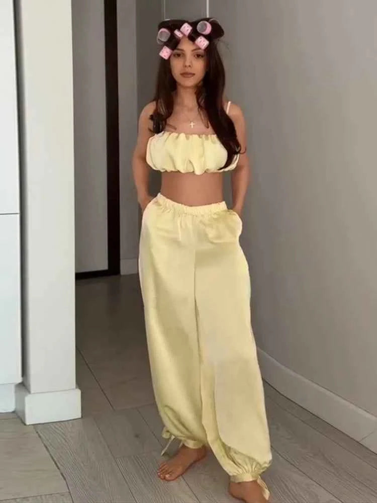 Elegant women's two-piece set by Chin.Sweety with a pleated top and elastic pants, perfect for parties and special occasions.