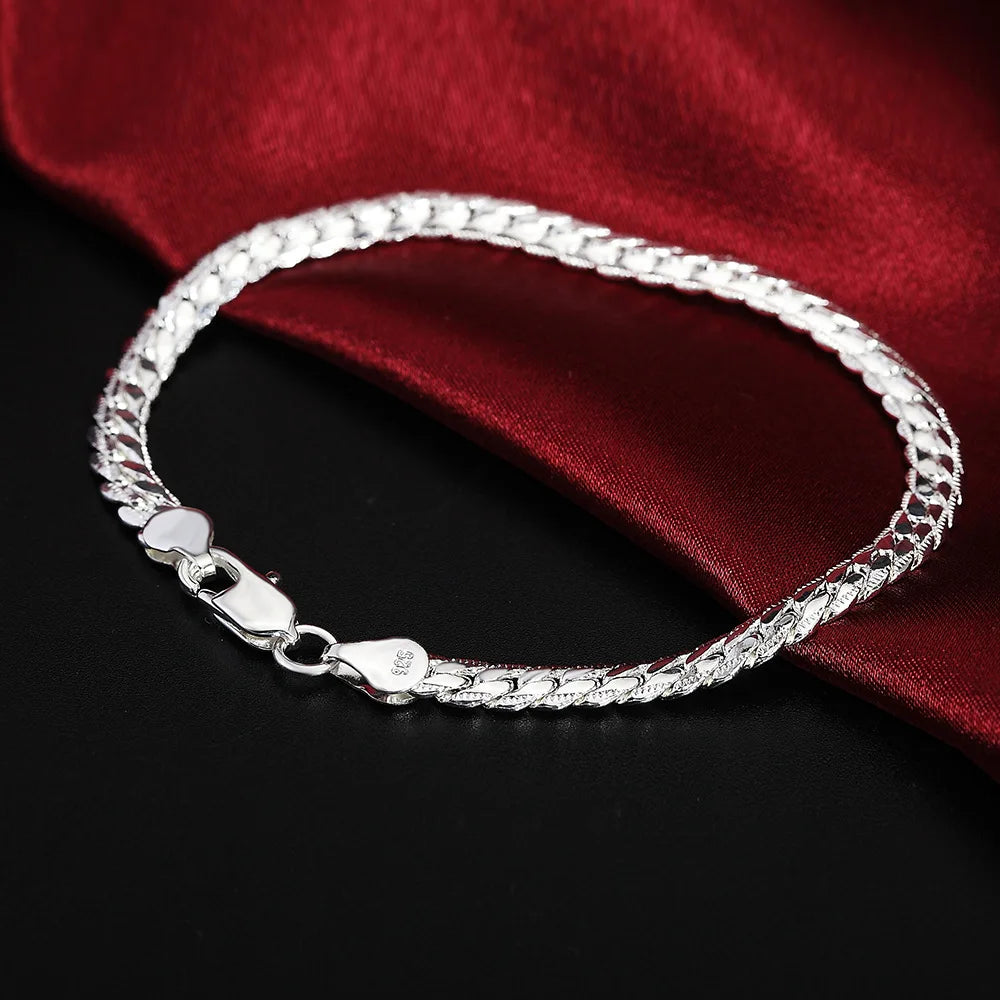 Sterling silver 925 bracelets for women and men with sleek, modern designs, featuring smooth metal surfaces and adjustable clasps.