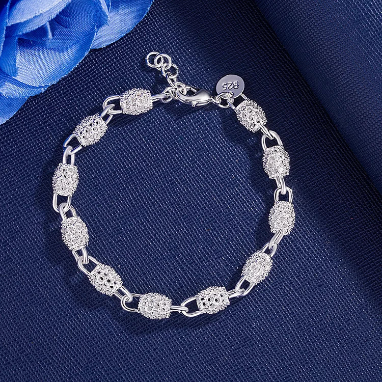 Sterling silver 925 bracelets for women and men featuring sleek, modern designs, shown on a neutral background.