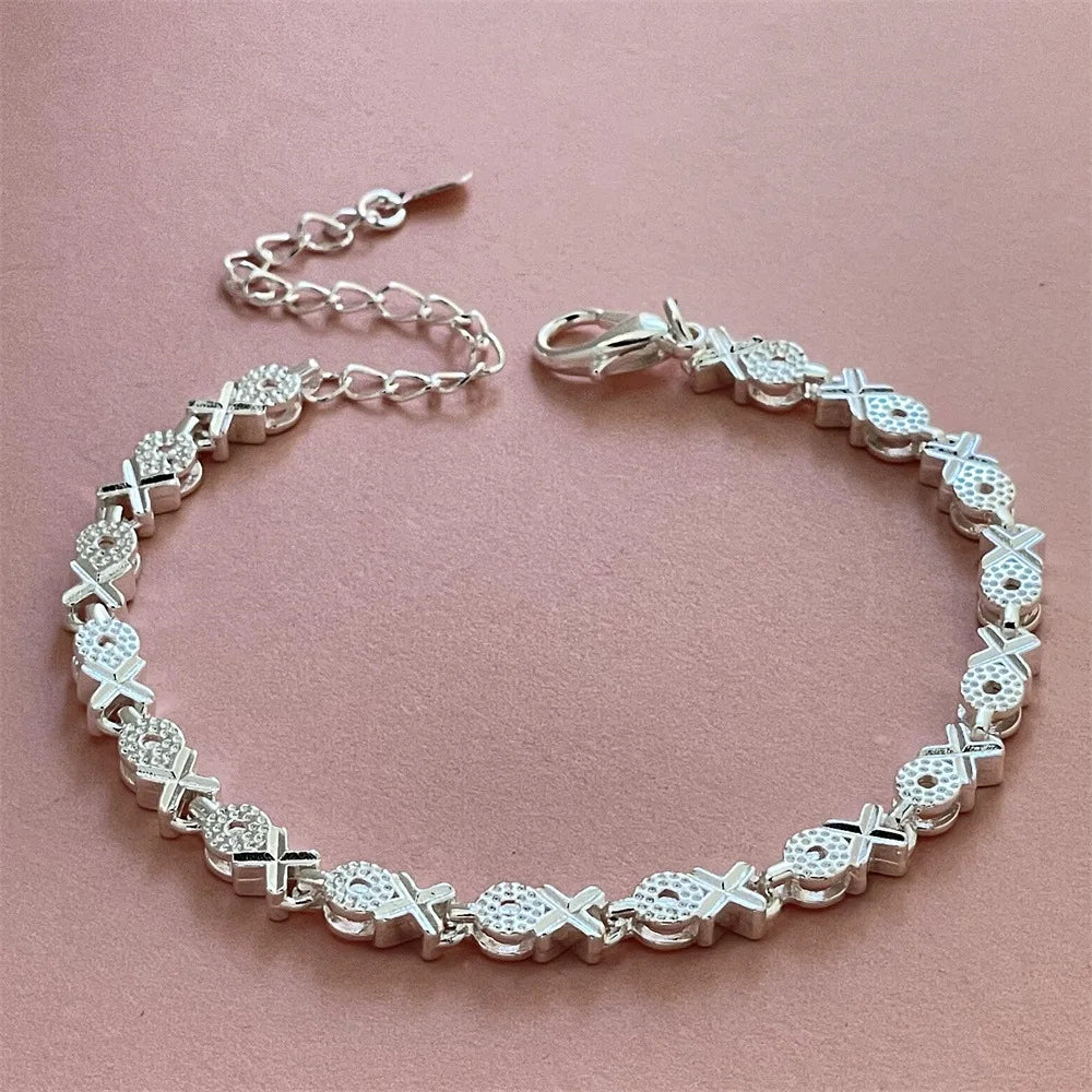 Sterling silver 925 bracelets for women and men, featuring sleek designs, showcased on a neutral background.