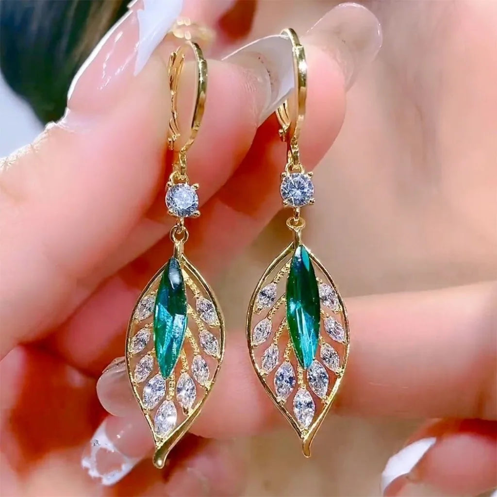 Green zircon leaf drop earrings for women, featuring black hooks and elegant jewelry design by Corporación Turística.