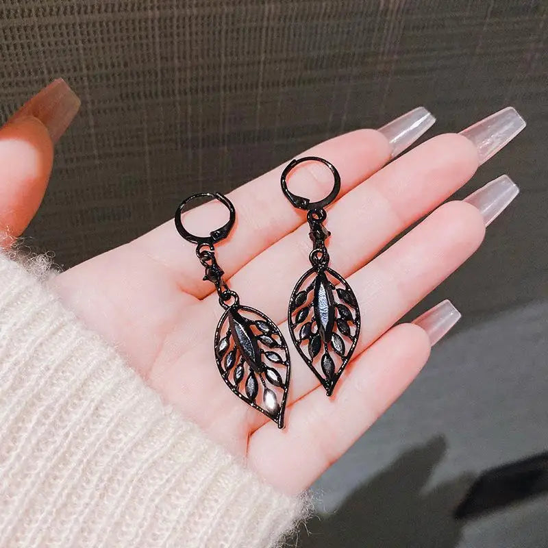 Green zircon leaf dangle earrings for women, black metal, elegant jewelry by Corporación Turística.