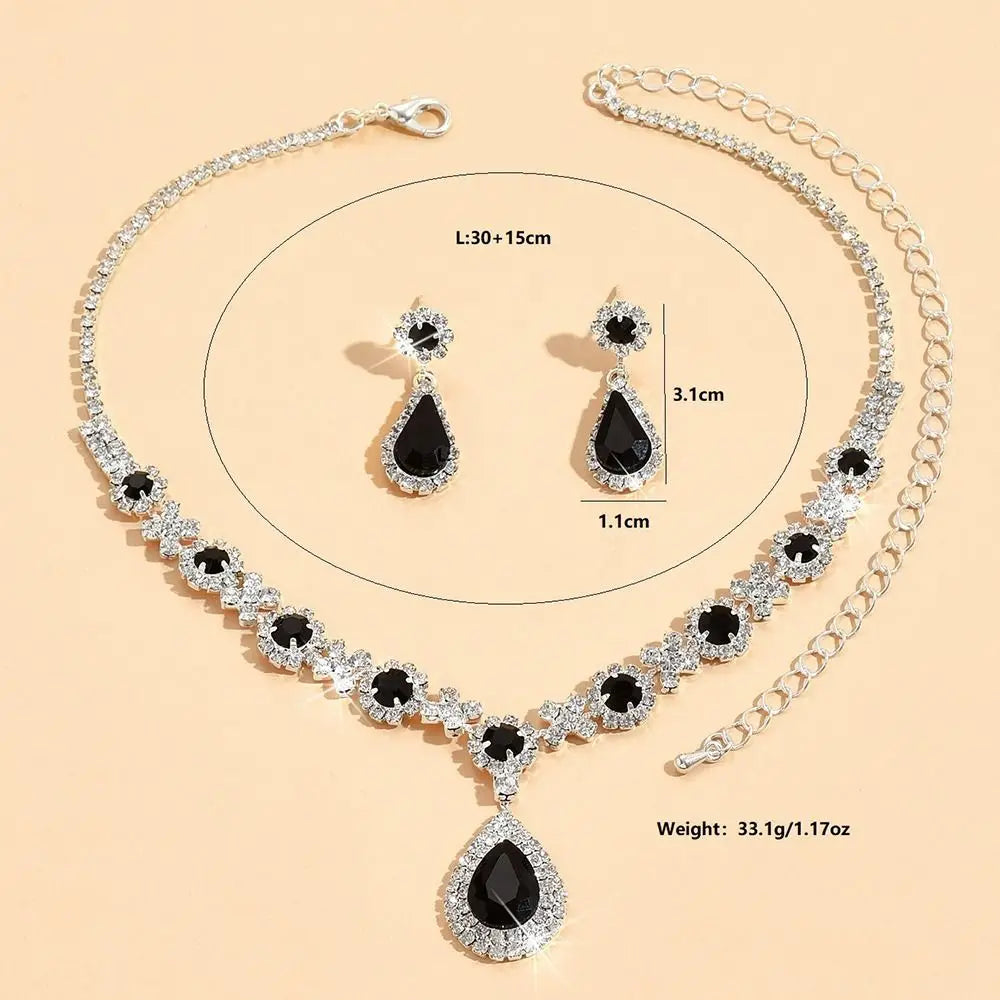 Crystal jewelry set with matching earrings and necklace featuring elegant design, perfect for special occasions.