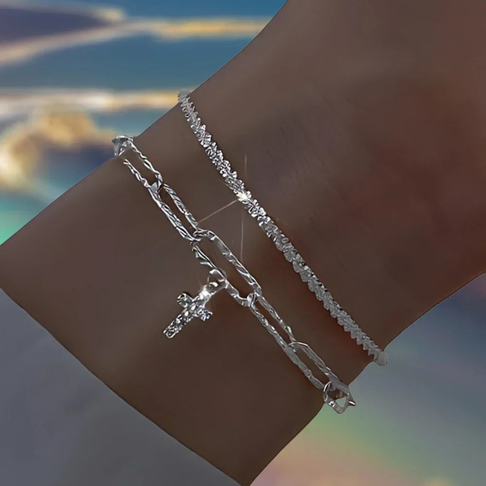Six imitation diamond silver bracelets featuring sparkling stones, crafted by Corporación Turística, displayed on a neutral background.
