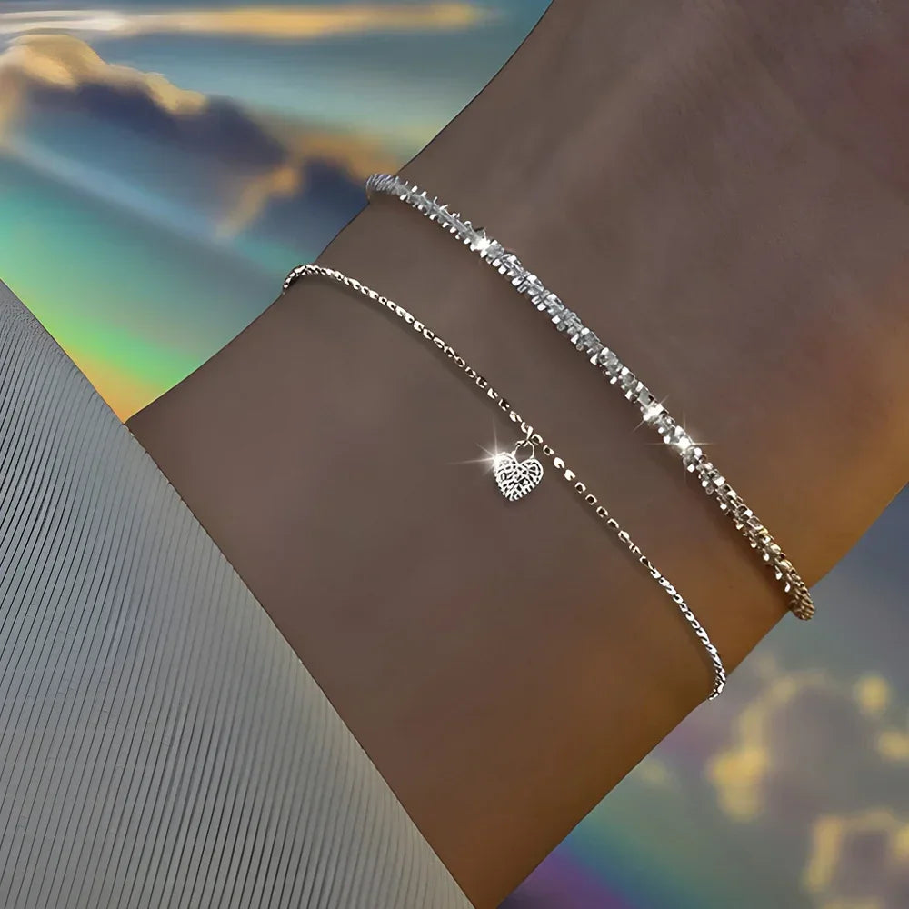Six imitation diamond silver bracelets from Corporación Turística, featuring sparkling cubic zirconia accents on polished silver bands.