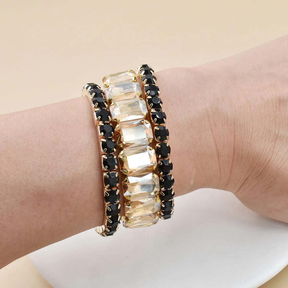 Three new women's crystal gemstone bracelets with geometric designs, featuring colorful, shiny beads for stylish wrist accessories.